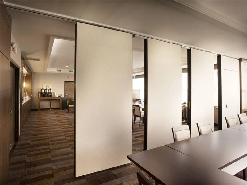 Acoustic conference room divider wall panels being deployed in a modern corporate meeting room Acoustic conference room divider wall panels being deployed in a modern corporate meeting room