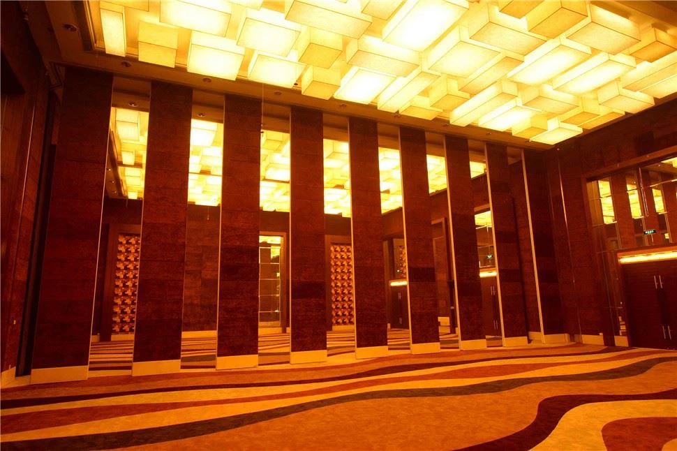 Ultra-high soundproof movable partition walls installed in a luxury hotel banquet hall, featuring custom dark finish and heavy-duty track system. Ultra-high soundproof movable partition walls installed in a luxury hotel banquet hall, featuring custom dark finish and heavy-duty track system.